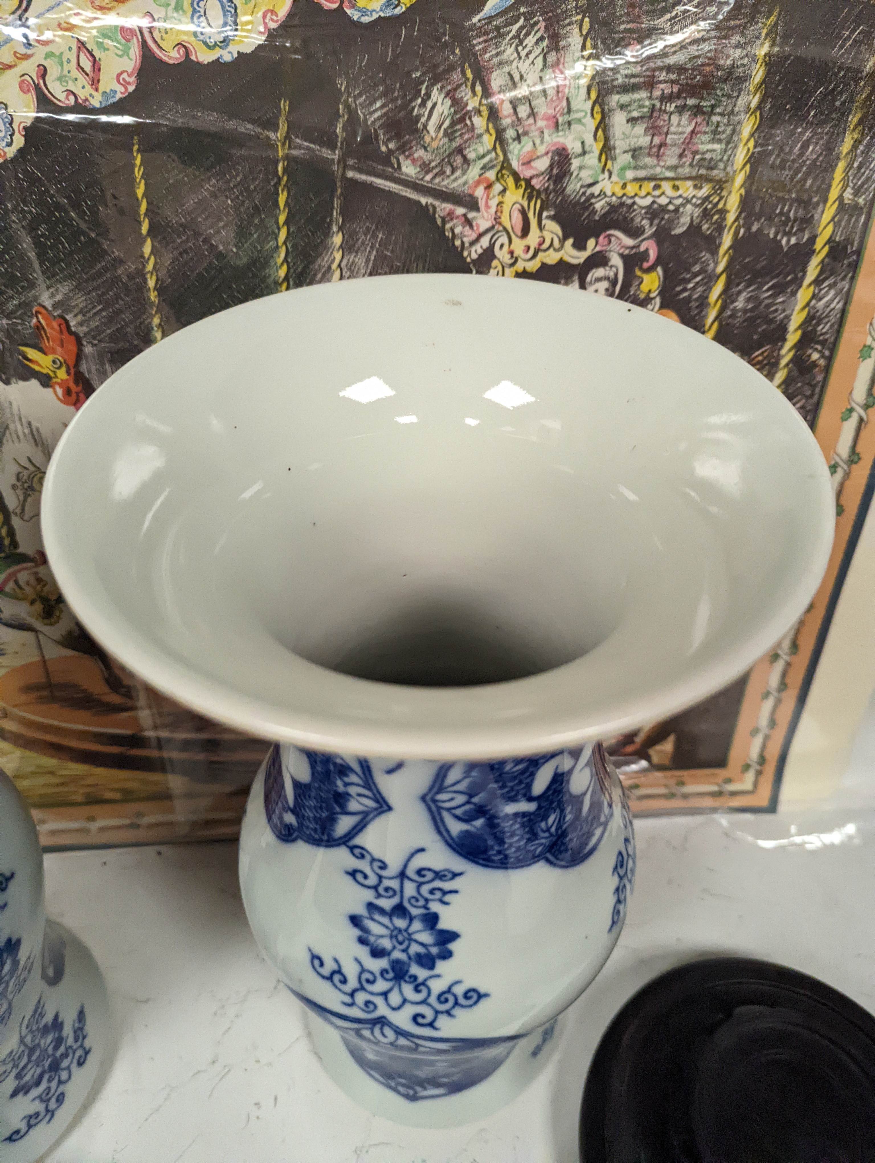 A pair of Chinese blue and white vases on stands and 6 further wood stands. Vases 35cm
